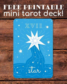 a blue and white christmas card with the words free printable mini tarot deck