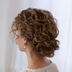 Updos With Curly Hair, Curly Hair Bun Styles Wedding, Low Updo Curly Hair, Curly Hair Bun For Wedding, Curly Hair Bridal Bun, Curly Bun Bridal Hair, Short Natural Curly Hair Updo, Short Curly Bridesmaid Hair, Wedding Hairstyle For Natural Curly Hair Half Up Half Down