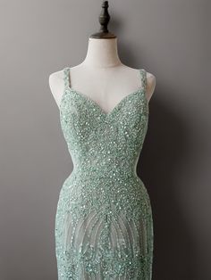 Embrace timeless elegance with our Mint Green Pretty Sequin and Beaded Spaghetti Strap Dress. This stunning evening gown showcases intricate sequin and beadwork that shimmers with every step you take. The delicate spaghetti straps and flattering sweetheart neckline add a touch of romance to this exquisite piece, making it ideal for any formal event. Intricate Sequin and Beadwork: Adorned with shimmering sequins and beads, this gown exudes sophistication and glamour. Romantic Spaghetti Straps: The dainty spaghetti straps paired with a sweetheart neckline create a graceful and feminine silhouette. Floor-Length Elegance: The floor-length design of the gown ensures a majestic and enchanting presence, perfect for evening occasions. Step into the spotlight with this beautiful mint green gown, cr Elegant Sequin Dress With Spaghetti Straps For Wedding, Embellished Spaghetti Strap Sequin Wedding Dress, Elegant Sequin Wedding Dress With Spaghetti Straps, Beaded Evening Dress With Fitted Bodice For Prom, Beaded Gown With Fitted Bodice For Prom, Sequin Gown With Fitted Bodice And Spaghetti Straps, Fitted Bodice Sequin Gown With Spaghetti Straps, Embellished Spaghetti Strap Evening Dress For Wedding, Embellished Gown With Fitted Bodice And Spaghetti Straps