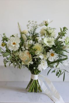 White and green natural style bridal bouquet with a white trailing ribbon Natural Wedding Bouquet, Katie White, Wildflower Wedding Bouquet, Summer Wildflowers, White Flower Bouquet, Green Bouquet, Bridal Bouquet Flowers