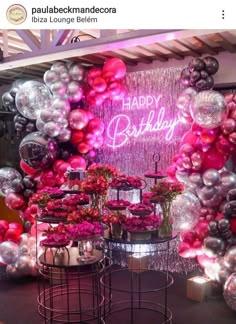 a birthday party with balloons and flowers