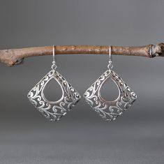 "Stunning Bali Silver filigree charms dangle from balled silver earwires. Please notice the amazing detail in the silver. These gorgeous go-with-everything statement earrings complete any outfit for daytime or evening. Bali Silver charms: 29.5x32mm Total length of earrings: 1 5/8\" All silver is sterling. As the owner, maker, designer, and curator of this shop, I take great pride in providing you with jewelry that you will love to wear everyday, for special occasions, and for many years to come. Ornate Sterling Silver Nickel-free Chandelier Earrings, Ornate Sterling Silver Teardrop Earrings For Gift, Ornate Sterling Silver Teardrop Earrings As Gift, Sterling Silver Dangle Jewelry With Intricate Design, Unique Sterling Silver Earrings With Intricate Design, Ornate Sterling Silver Pierced Chandelier Earrings, Ornate Sterling Silver Chandelier Earrings As Gift, Ornate Teardrop Jewelry With Matching Earrings, Sterling Silver Chandelier Earrings With Intricate Design For Gift