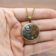 Introducing the Popular Steampunk Mechanical Time Stone Necklace! This fashion-forward statement piece is perfect for steampunk lovers, cosplayers, and industrial enthusiasts Its unique design features intricate Gear-like mechanisms, metallic accents, and beautiful Time Stones for a stylish impact. The necklace is constructed with an adjustable chain for a comfortable fit, while the Time Stones add a touch of personality. Whether for special occasions, costume events, or everyday looks, this Vic Time Stone, Gothic Witch, Mens Gear, American Express, Glass Necklace, Metallic Accents, Doll Accessories, Stone Necklace, Everyday Look