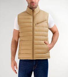 26.5" zip front quilted vest in 100% nylon.Center front zipper.Stand collar.Slanted zipper chest pocket.Welt body pockets.Fully lined.Imported. Nylon Vest With Zipper Closure For Winter, Winter Nylon Vest With Zipper Closure, Casual Fitted Vest With Zipper Closure, Sleeveless Nylon Outerwear With Zipper Closure, Sleeveless Outerwear With Zipper Closure, Sleeveless Vest With Zipper For Outdoor Activities, Outdoor Activities Vest With Zipper Closure, Nylon Vest With Zipper Closure For Fall, Outdoor Puffer Vest Jacket Sleeveless