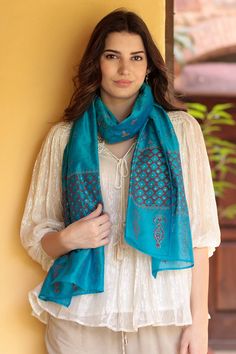 Designed from chanderi , a traditional Indian fabric crafted from cotton and silk, Isha Jain's exquisite shawl is lightweight with a fine, luxurious feel. Hand woven by Indian artisans, the cotton-silk shawl features a block-printed floral pattern in sapphire and cyan, while golden zari thread provides the final shimmering touch. Festive Pashmina Dupatta With Woven Motifs, Festive Silk Scarves With Traditional Patterns, Festive Woven Motifs Dupatta Shawl, Blue Traditional Scarves For Festive Season, Diwali Chanderi Shawl, Festive Silk Shawl With Traditional Patterns, Festive Scarves With Traditional Patterns And Drape, Festive Blue Traditional Scarf, Bohemian Art Silk Dupatta With Self Design