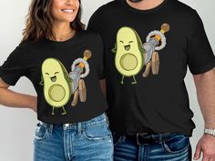 Explore fun with our Avocado Cartoon T-Shirt. Featuring a cute avocado character and cannon graphic, it's perfect for avocado lovers. A unique and playful tee that adds humor and charm to any outfit. Ideal for casual wear or gifting, this shirt brings smiles and style together. Enjoy comfort and laughter with this delightful avocado print top. Avocado Character, Avocado Cartoon, Avocado Design, Avocado Print, Cute Avocado, Cartoon T Shirt, Funny Graphic Tees, Great Conversation Starters, Cartoon T Shirts