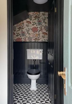 an open door leading to a toilet in a bathroom