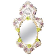 a decorative mirror with flowers on it