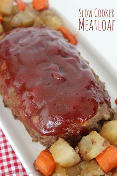 meatloaf with carrots, potatoes and gravy on a plate