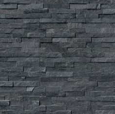 a black stone wall is shown in this image