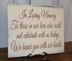 a wooden sign that says in loving memory to those in our lives who cannot not celebrate with us today we hear you with our hearts