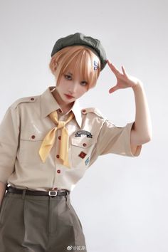 a woman in uniform is posing with her hand up to her head and wearing a hat