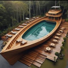 a large wooden boat sitting on top of a body of water