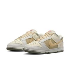 The Nike Dunk Low combines retro flair with modern comfort. Crafted from a mix of leather and textile, these kicks pay homage to '80s basketball aesthetics. The padded, low-cut collar ensures all-day comfort, whether you’re hitting the court or strolling the streets. The colorway features a sophisticated blend of Coconut Milk, Sesame, Alabaster, Light Bone, Neutral Olive, and Dark Stucco. With its extra Swoosh on the heel, this Dunk Low is a stylish nod to the past, perfect for sneaker enthusiasts and fashion-forward individuals alike. Dunk Low Light Bone, Alabaster Light, 80s Basketball, Dark Stucco, Basketball Icon, Yeezy Boots, Nike Models, Clog Boots, Dunks Nike