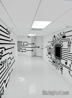 an empty room with black and white circuit board wallpapers on it's walls