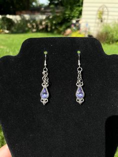 Beautiful authentic amethyst gemstone earrings. Unique vintage style of plating around the gems. Looks gorgeous in the sunlight! Purple Metal Drop Earrings, Purple Teardrop Metal Earrings, Purple Pierced Metal Jewelry, Purple Drop Crystal Earrings, Purple Metal Pierced Jewelry, Elegant Handmade Purple Clip-on Earrings, Vintage Teardrop Gemstone Earrings, Purple Teardrop Metal Jewelry, Silver Amethyst Drop Crystal Earrings