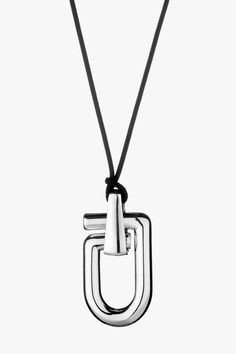 The Mega Reine necklace has been cast in Italy from polished silver and is looped through woven black cord. It features a single oversized pendant that resembles a snap hook in its most simplified form Composition: 925 Silver (47.6g) Made in Italy Size & Fit Length: 50mm Width: 26mm Thickness: 10mm Cord Length: 113cm Pre-Order Please expect a 3-week waiting period. Thank you for your patience. Care Always remove your jewellery when applying perfume, lotions and creams, or even better, always wea Applying Perfume, 3d Jewelry, Physical Activity, Physical Activities, Ring Bracelet, Jewelry Care, Chemicals, Pre Order, 925 Silver