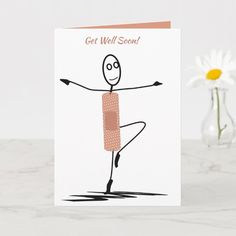 a greeting card with a drawing of a person doing yoga on the front, and yellow flowers in the background