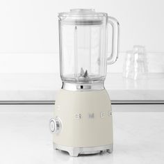 a white blender sitting on top of a counter