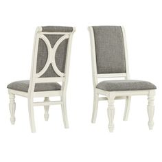 two white chairs sitting next to each other on a white floor with grey fabric upholstered back