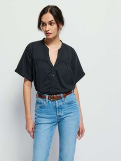 Your spring capsule called. It needs this. With a casual notch neckline, a slightly gathered seam across the bust, and boxy short sleeves, it's the blouse that's perfect for low-key coffee dates and subtle chic looks. (This one comes in Jet Black.) | Women's Filippa Blouse Top in Jet Black | Ethical Essentials Chic Short Sleeve Top For Casual Gatherings, Versatile Short Sleeve Top For Spring Workwear, Effortless Short Sleeve Blouse For Casual Gatherings, Casual Blouse With Notched Neckline, Versatile Short Sleeve Blouse For Daywear, Short Sleeve Blouse For Casual Spring Gatherings, Chic Short Sleeve Blouse For Casual Gatherings, Chic Short Sleeve Blouse For Everyday, Short Sleeve Black Blouse For Everyday