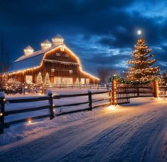 a barn in the snow with christmas lights on it's sides and a fence