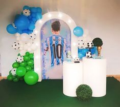 a soccer themed birthday party with balloons and decorations