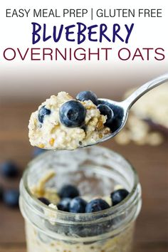 blueberry overnight oats in a glass jar with a spoon full of oatmeal