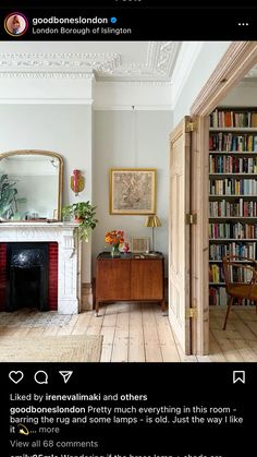 an image of a living room with fireplace and bookshelf in the background on instagram