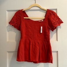 Nwt Madewell Red Eyelet-Sleeve Lucie Smocked Peplum Blouse Size Xxs New With Tags Name Written On Inside Tag (Not Visible When Worn) Buttoned Down The Back, This Smocked Top Is Fitted Through The Bodice With A Flowy Peplum Waist. So Pretty (Hello, Eyelet Embroidered Sleeves) Yet Totally Comfy. Regular Fit. Cotton. Fitted Smocked Top With Short Sleeves, Red Fitted Smocked Top, Casual Puff Sleeve Peplum Top For Summer, Cotton Peasant Top With Smocked Back And Short Sleeves, Spring Red Smocked Top, Casual Peplum Top With Smocked Bodice And Puff Sleeves, Red Smocked Top For Spring, Summer Short Sleeve Smocked Top, Fitted Short Sleeve Smocked Peasant Top