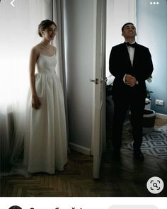 a man in a tuxedo standing next to a woman in a white dress