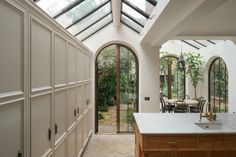 a kitchen with an island and skylight in it