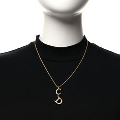 This is an authentic CHRISTIAN DIOR Metal Crystal CD Necklace in Gold. This beautiful necklace is crafted of polished gold metal and features a crystal CD Dior charm in the middle, and a lobster clasp for easy wear. Cd Necklace, Beautiful Necklace, Easy Wear, Necklace Gold, Beautiful Necklaces, Christian Dior, Lobster Clasp, Gold Metal, Cd