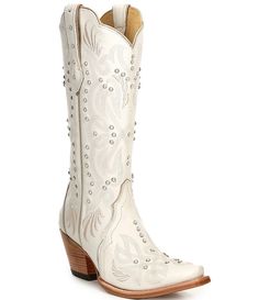 a pair of white cowboy boots with studded details