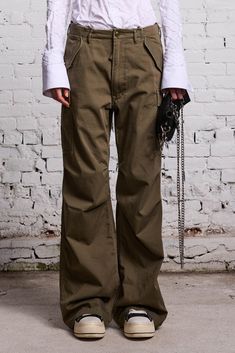 This baggy wide leg cargo pant features oversized pockets and classic military details. Color: Olive Sasha is 5 10 and wearing size 27 Bust 32 ; Waist 23 ; Hips 35 100% Cotton R13WR097-R290B Imported This style runs slightly large. If in between sizes, we recommend sizing down. Oversized Pockets, Cargo Pant, Wide Leg, Pants, How To Wear, Color, Trousers