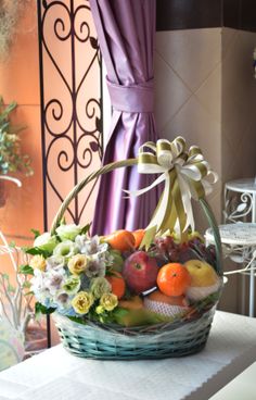 a basket filled with fruit sitting on top of a table