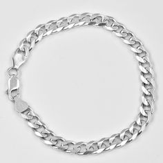 This curb link bracelet is crafted in lustrous sterling silver and features a fancy curb link (square-round) chain. Enhanced with a high polished finish, this bracelet measures 8.25 inch (21cm) in length, link - 6mm wide, secures with a lobster clasp. 14gr. Definitely, eye-catching unisex jewelry, this chain necklace made in Italy. Excellent condition. Old stock. Elegant Sterling Silver Bracelet With Cuban Link Curb Chain, Elegant Sterling Silver Bracelets With Curb Chain, Classic Sterling Silver Cuban Link Bracelet, Classic Silver Charm Bracelet With Silver Chain, Classic Silver Chain Link Charm Bracelet, Classic Sterling Silver Cuban Link Bracelet With Silver Chain, Modern Sterling Silver Chain Bracelet With Curb Chain, Classic Silver Cuban Link Bracelet With Oval Links, Classic Silver Cuban Link Bracelet Gift