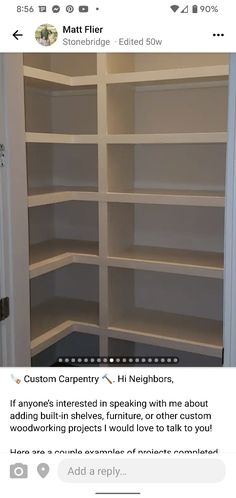 an empty closet with white shelving in the middle and no shelves on each side