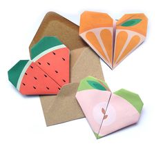 three pieces of paper with fruit on them