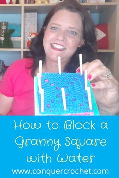 a woman holding up a cake with candles in it and the words how to block a granny square with water