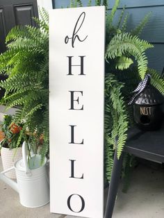 a wooden sign that says, off helio on it next to potted plants