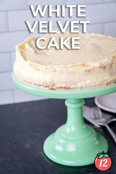 a white velvet cake sitting on top of a green cake plate with the words, how to make white velvet cake