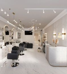 the salon is clean and ready for customers to take their own seats in it's white, marble - like environment