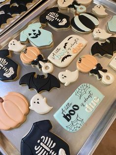 decorated cookies in the shape of bats and pumpkins