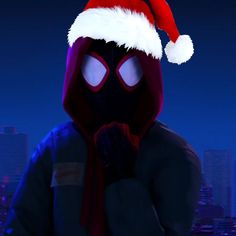 a spider man wearing a santa hat in front of a cityscape at night