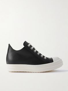 For Rick Owens, cool street style just comes naturally. These sneakers are made from supple black leather that contrasts the laces, rubber toe caps and matching 30mm soles, which offer plenty of traction. Modern Leather Platform Sneakers With Rubber Heel Cap, Modern Black Sneakers With Rubber Toe Cap, Platform Sneakers With Leather Sole For Streetwear, Low-top Platform Sneakers With Leather Sole For Streetwear, White Leather Sneakers With Rubber Toe Cap, White Sole Leather Sneakers With Rubber Toe Cap, Leather Platform Sneakers For Streetwear With Rubber Heel Cap, Leather Lace-up Custom Sneakers With Rubber Toe Cap, Custom Leather Lace-up Sneakers With Rubber Toe Cap