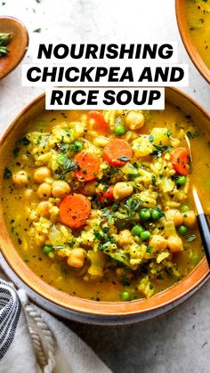 two bowls of soup with carrots, peas and chickpeas in it on a white surface