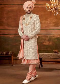 Designer Peach Wedding Pakistani Sherwani With Kurta Chudidaar
Designer custom made Peach fully embroidered sherwani with chudidar . The latest heavy silk embroidered sherwani is best choice for reception wear . It is suited for Indian and Pakistani wedding wear . 
One of the standout features of this sherwani is the intricate embroidery adorning its surface. Our skilled artisans have meticulously handcrafted every detail, using fine threads and intricate patterns that showcase traditional Indian craftsmanship at its best. The embroidery showcases a harmonious blend of motifs, ranging from floral designs to intricate geometric patterns, creating a visually stunning ensemble that captures attention and admiration . Please note there can be slightly difference between the image and the pro Engagement Reception