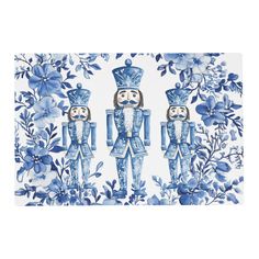 two blue and white nutcrackers on a floral background