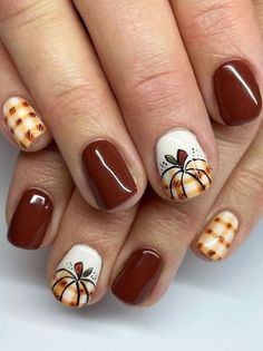 19 Fall Nails That We Utterly Adore Fall Nails Scarecrow, Fall Plaid Pumpkin Nails, Fall Nails Ideas Autumn Plaid, Pumpkin Plaid Nails, Fall Harvest Nail Designs, Thanksgiving Plaid Nails, Plaid Pumpkin Nails, August Gel Nails Ideas, Pumpkin Gel Nails